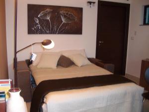 A bed or beds in a room at VILLA SINGOLA -SOLE-LUNA-Casavilladusoleil