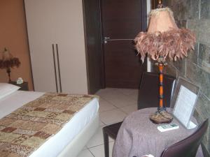 A bed or beds in a room at VILLA SINGOLA -SOLE-LUNA-Casavilladusoleil