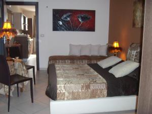 A bed or beds in a room at VILLA SINGOLA -SOLE-LUNA-Casavilladusoleil