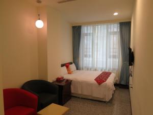 Postel nebo postele na pokoji v ubytování Sun Moon Lake Crown Yu Hotel