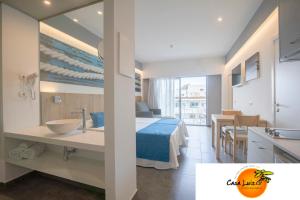 
a hotel room with a bed and a table at Casa Luis Apartments in Santa Eularia des Riu
