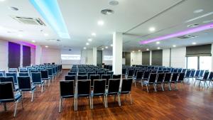 a room with rows of chairs in a room at Hotel Moran & SPA in Powidz +82 photos