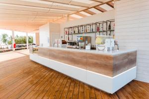 a kitchen with a counter in a room at Torre Cintola Greenblu Sea Emotions in Monopoli