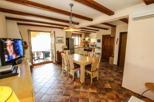 a kitchen and dining room with a table and chairs at Villa Istriana Jakob with pool in Vabriga