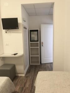 TV a/nebo společenská místnost v ubytování Hotel Nelson
