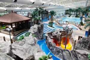 a water park in a mall with a water slide at Sono Moon Danyang in Danyang