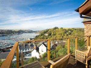 a balcony with a view of a marina at Totherside in Dartmouth