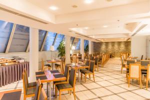 Restoran või mõni muu söögikoht majutusasutuses Hestia Hotel Ilmarine