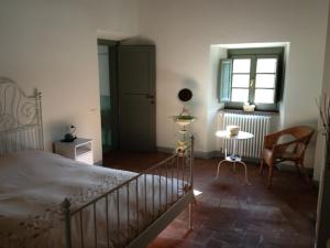 Postel nebo postele na pokoji v ubytování Agriturismo Le Dogane