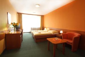 Posteľ alebo postele v izbe v ubytovaní Hotel Strážnice