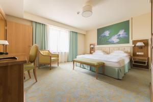 Postel nebo postele na pokoji v ubytování Hotel Sonnenhof