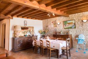 a dining room with a table and chairs at gites de la Vaysse in Vergt-de-Biron