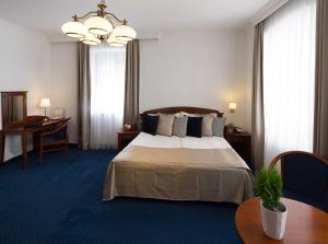 Postel nebo postele na pokoji v ubytování Fonte Hotel