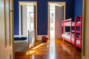 Postel nebo postele na pokoji v ubytování La Palma Hostel Leiria