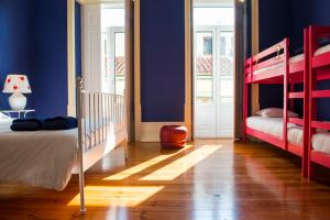 Postel nebo postele na pokoji v ubytování La Palma Hostel Leiria