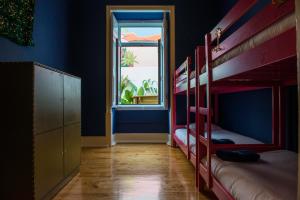 Postel nebo postele na pokoji v ubytování La Palma Hostel Leiria