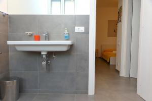 a bathroom with a sink on the wall at casa verdemare in Cefalù +37 photos
