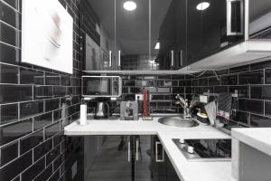 Kuchyň nebo kuchyňský kout v ubytování Argüelles Apartment