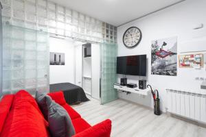 TV a/nebo společenská místnost v ubytování Argüelles Apartment
