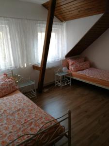 Postel nebo postele na pokoji v ubytování Pension Harmonie + 30 fotografií