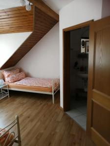 Postel nebo postele na pokoji v ubytování Pension Harmonie
