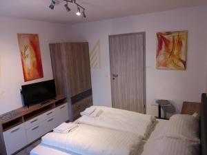 Letto o letti in una camera di Gasthof Weingrill