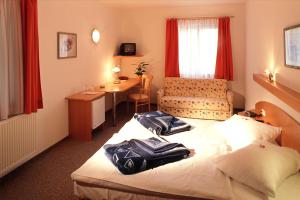 Letto o letti in una camera di Gasthof Weingrill