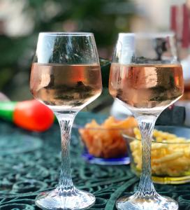 two glasses of wine sitting on a table at Château Logis de Roche in Clairac