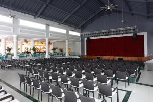 an empty hall with a stage and chairs at Bahia Principe Fantasia Punta Cana - All Inclusive in Punta Cana