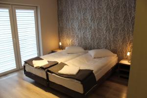 Voodi või voodid majutusasutuse Hotel Pod Strzechą toas