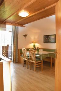 a kitchen and dining room with a table and chairs at Ferienhaus Steger Maria in Flachau