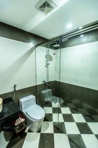 a bathroom with a toilet and a glass shower at Full House The Villa Hạ Long 5PN Karaoke Bida BBQ 18 Khách in Ha Long +111 photos