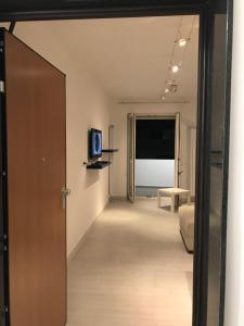 a hallway with a door leading to a living room at Bari Lory’s Home in Bari