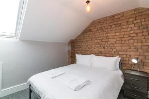 מיטה או מיטות בחדר ב-Salisbury Street Guesthouse