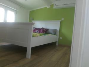 Tempat tidur dalam kamar di Résidence Hélène Boucher
