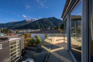 a balcony with a view of the mountains at Diamond Deluxe Central Queenstown in Queenstown