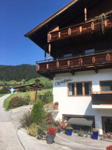 a building with a sign on the side of it at Landhaus Christina Alpbach in Alpbach