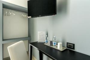 TV a/nebo společenská místnost v ubytování Merulana 139 Suites