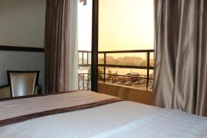 Postel nebo postele na pokoji v ubytování Al Khaleej Grand Hotel