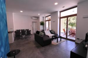 a living room with a couch and a table at Argo Apartments in Ljubljana