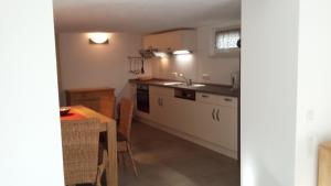 a kitchen with a sink and a counter top at Ferienwohnung Valentin in Hohenpeißenberg