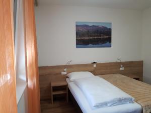 Posteľ alebo postele v izbe v ubytovaní Hotel Rimo