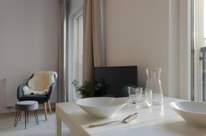 Televízia a/alebo spoločenská miestnosť v ubytovaní Apple Green Apartments