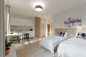 Posteľ alebo postele v izbe v ubytovaní Apple Green Apartments