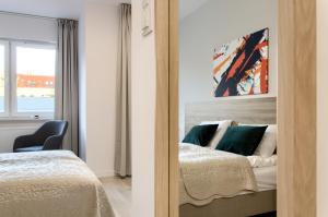 Posteľ alebo postele v izbe v ubytovaní Apple Green Apartments