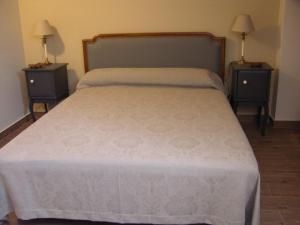 A bed or beds in a room at Albus Albi