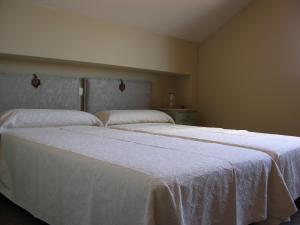 A bed or beds in a room at Albus Albi
