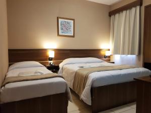 Postel nebo postele na pokoji v ubytování Astro Hotel + 23 fotografií