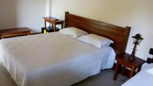 Postel nebo postele na pokoji v ubytování Pousada Viajantes do Tempo
