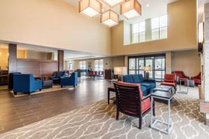 a lobby with chairs and a waiting room at Comfort Suites Denver near Anschutz Medical Campus in Aurora